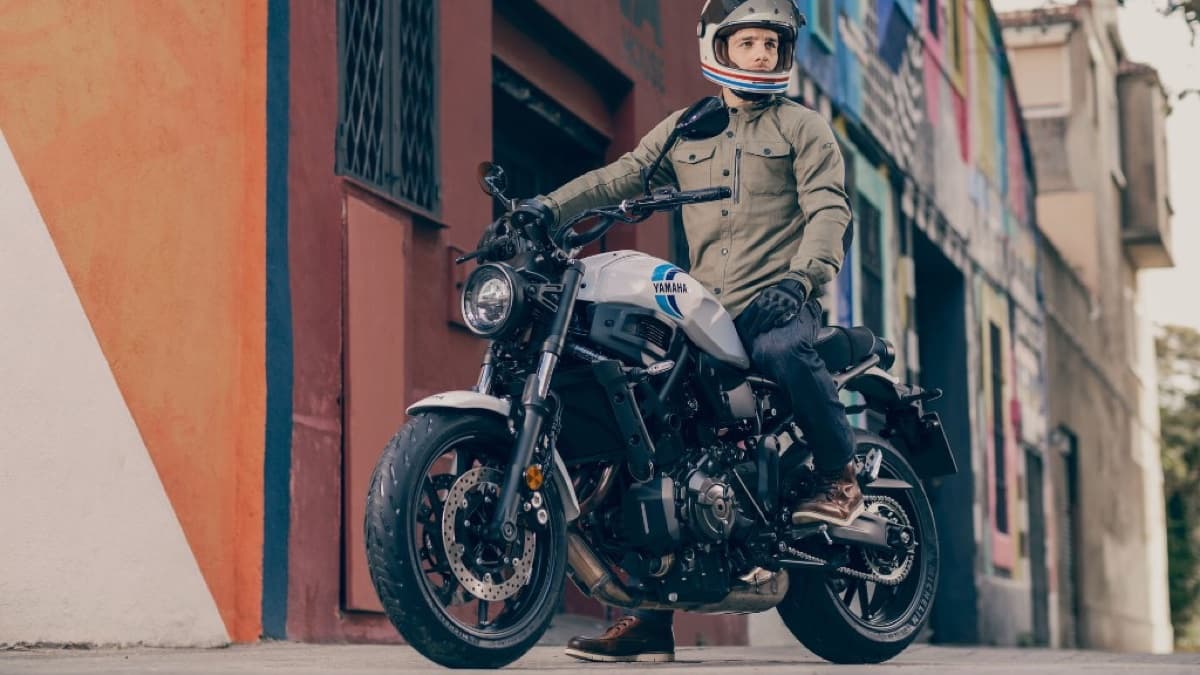 Rider on a Yamaha XSR700 learner-friendly motorcycle in an urban setting