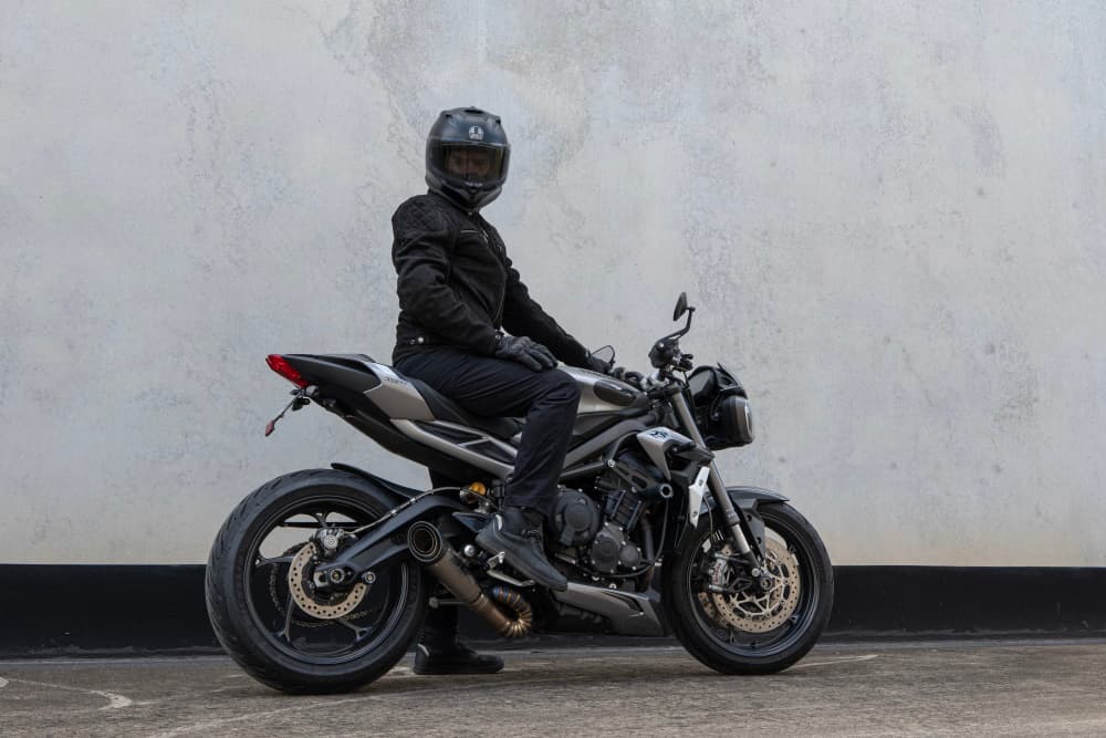 Shoei, Arai and AGV premium motorcycle helmets displayed for comparison